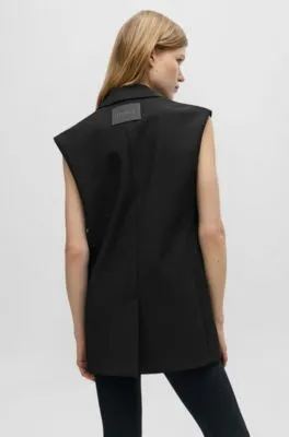Chaleco largo regular fit con forro de logos
