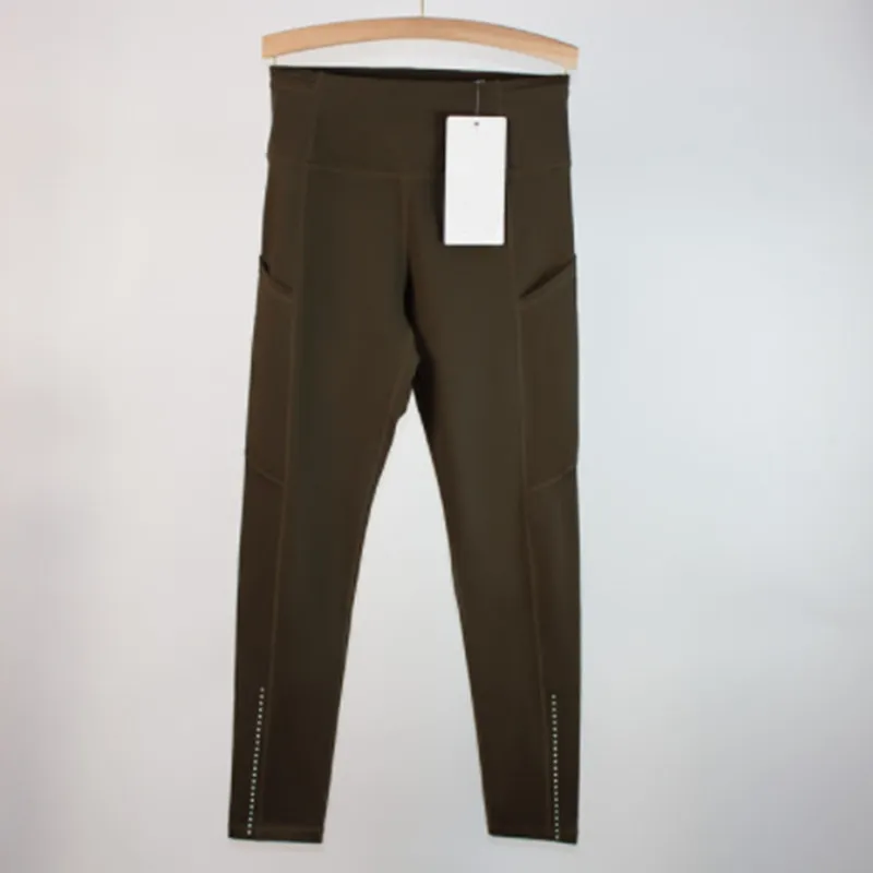 Los pantalones de yoga deportivos femeninos alinean leggings de bolsillo múltiples cepillados de doble cara para la conducción f