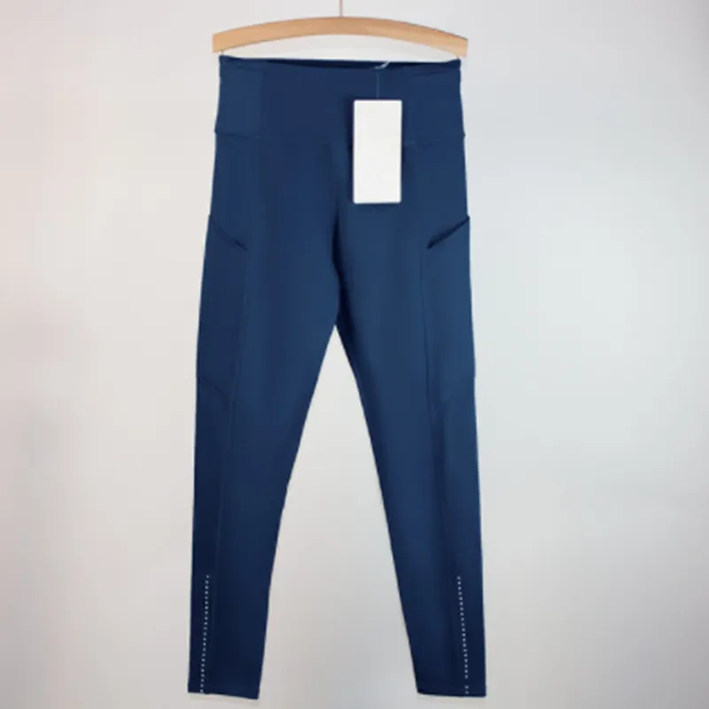Los pantalones de yoga deportivos femeninos alinean leggings de bolsillo múltiples cepillados de doble cara para la conducción f