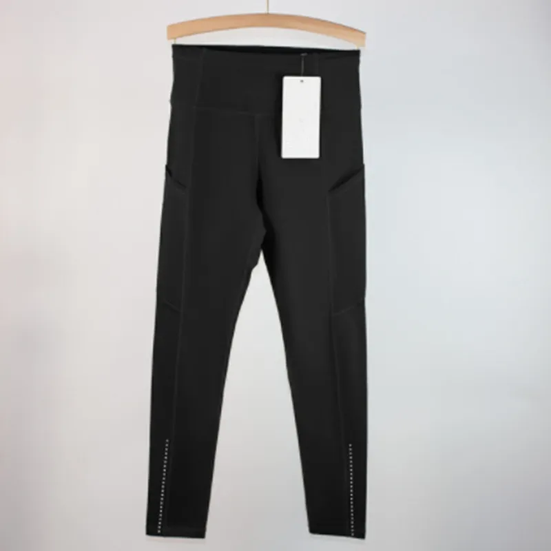 Los pantalones de yoga deportivos femeninos alinean leggings de bolsillo múltiples cepillados de doble cara para la conducción f
