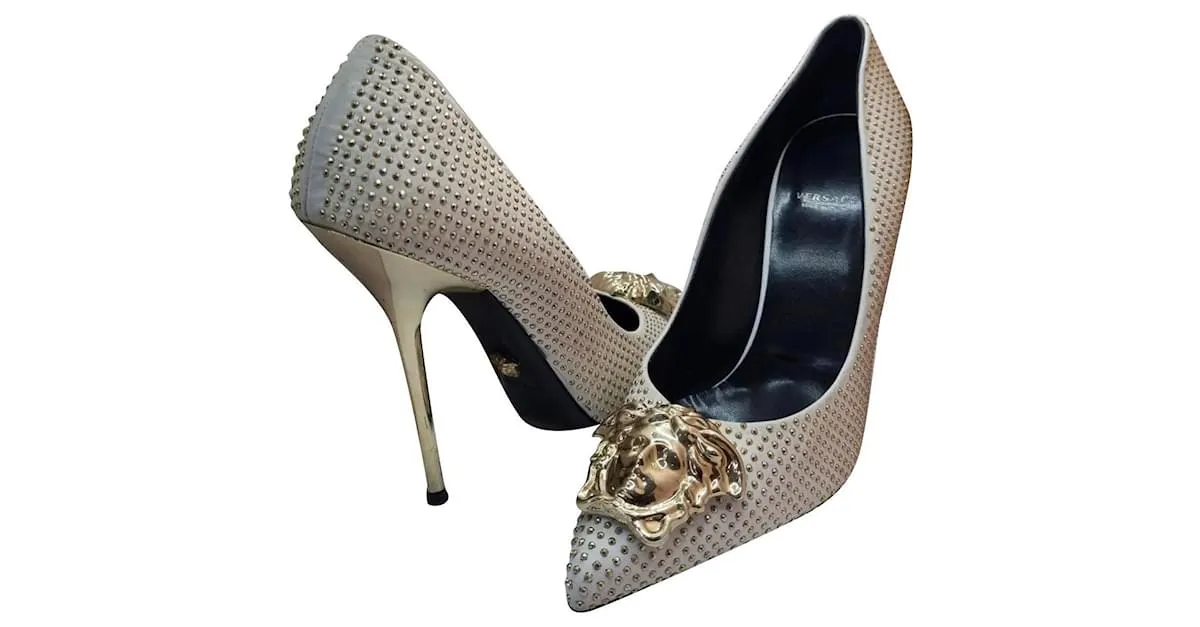 Medusa con tachuelas de cuero blanco/dorado de Versace 