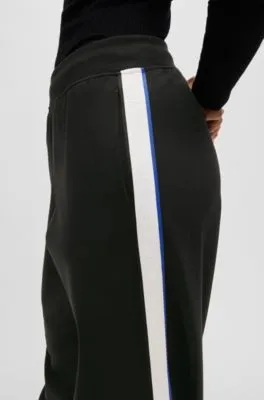 Pantalones de chándal de pernera ancha en algodón elástico con cinta de logos