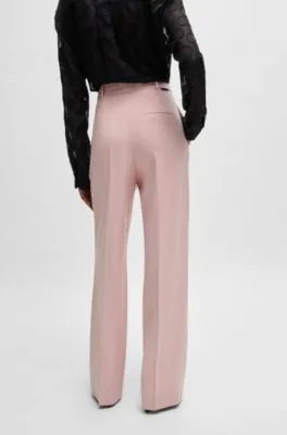Pantalones relaxed fit con pernera ancha y pinzas dobles