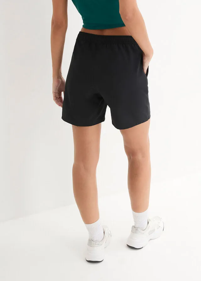 Pantalón deportivo de secado rápido con bolsillos con cremallera, hasta el tobillo Negro