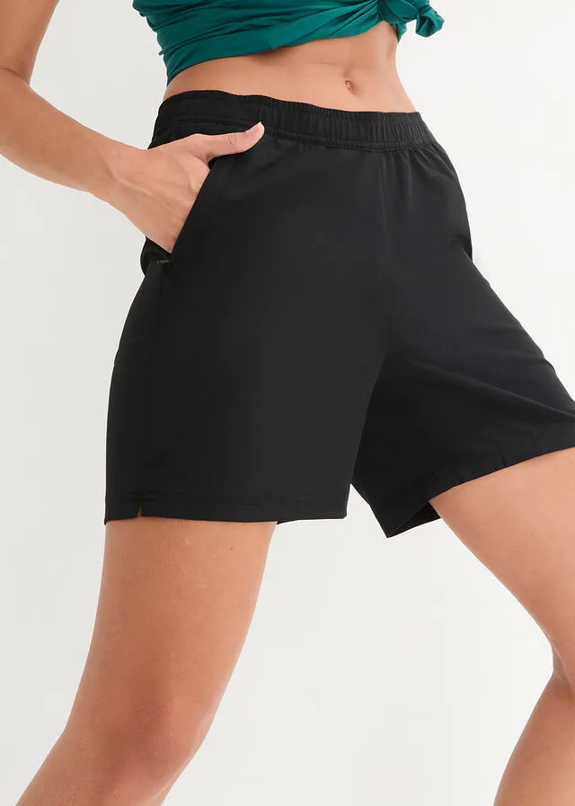 Pantalón deportivo de secado rápido con bolsillos con cremallera, hasta el tobillo Negro